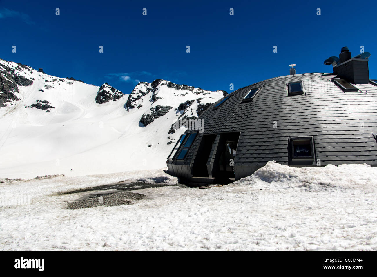 A man-made igloo shelter in Verbier Switzerland in summer Stock Photo