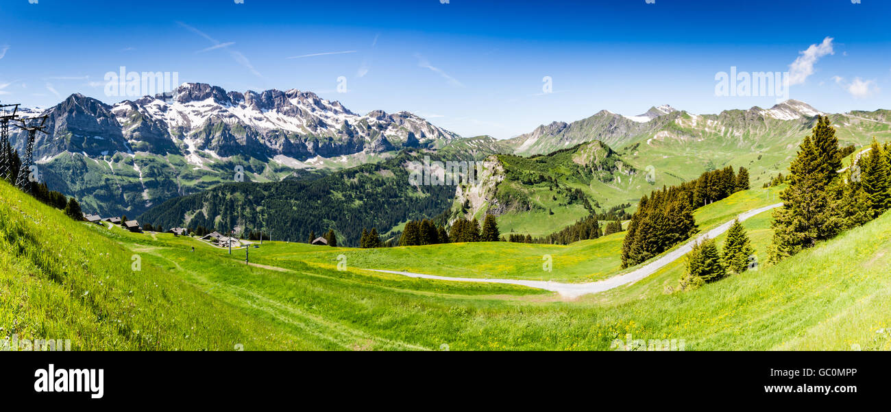 Panoramic view of the snow peaked Alps in Switzerland in Summer at Portes du Soleil Stock Photo