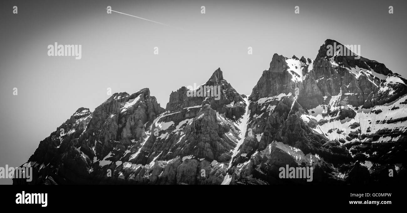 View of the snow peaked alps from Portes du Soleil in Switzerland in summer converted to black and white Stock Photo