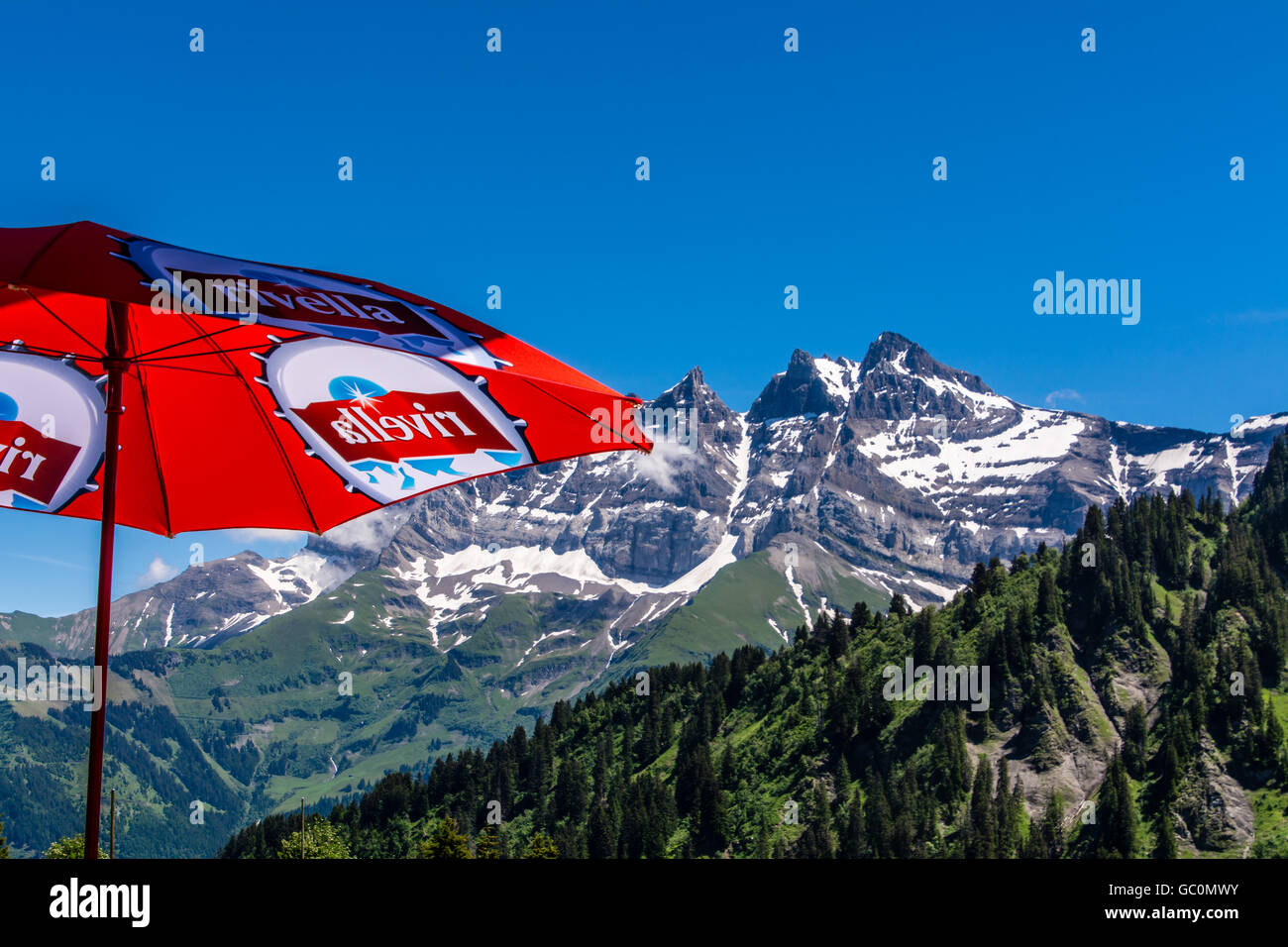 View of the snow peaked Alps in Switzerland in Summer Stock Photo