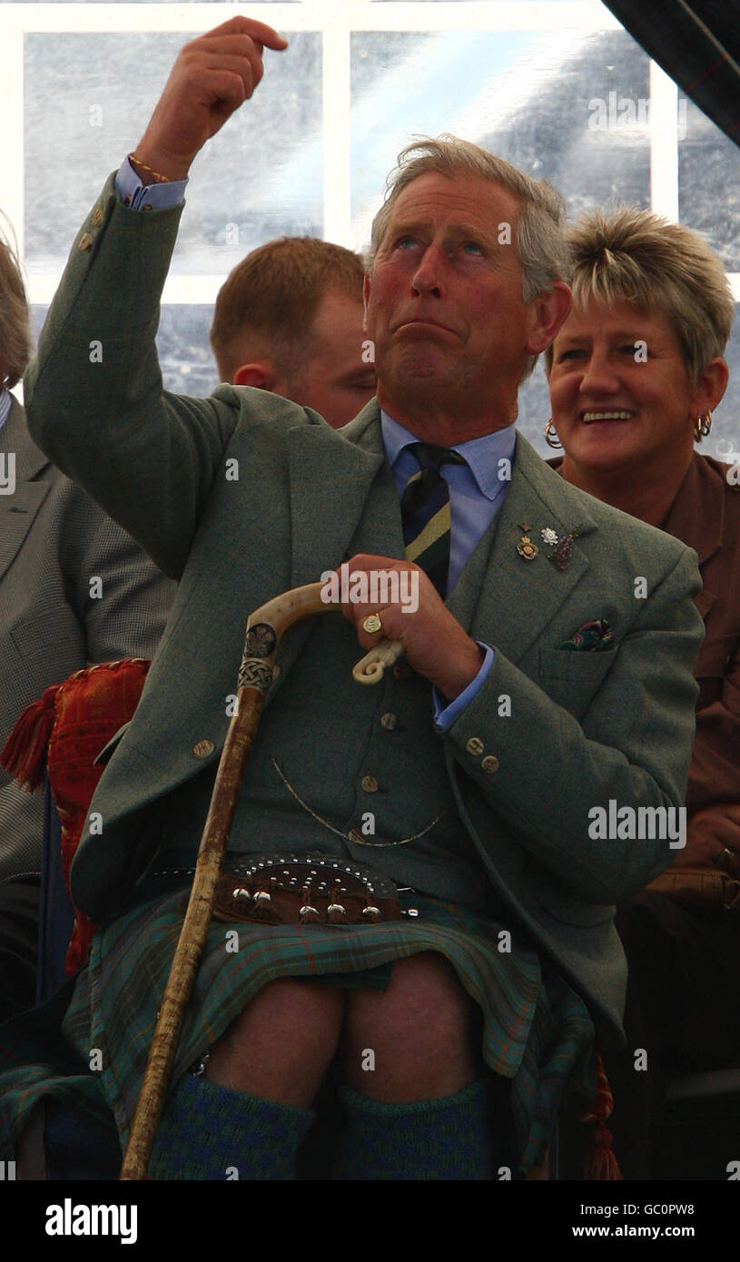 The Prince of Wales at the Mey Highland games in Caithness. The games feature an array of events, such as tossing the caber, shot-put and hammer throwing. His annual visit keeps up the strong royal links to the area Stock Photo