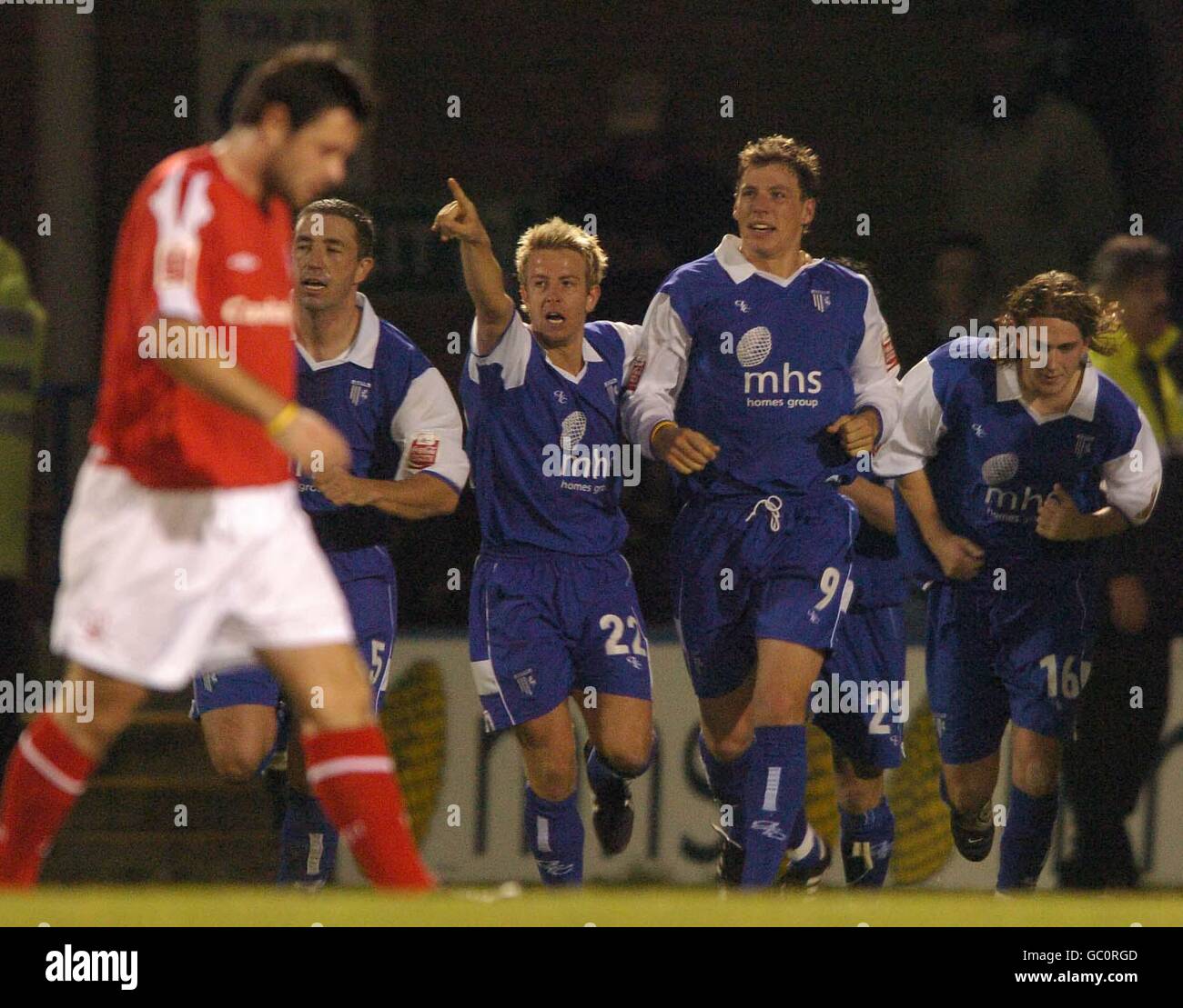 Gillingham's Danny Spiller (no22) celebrates the equalising goal with
