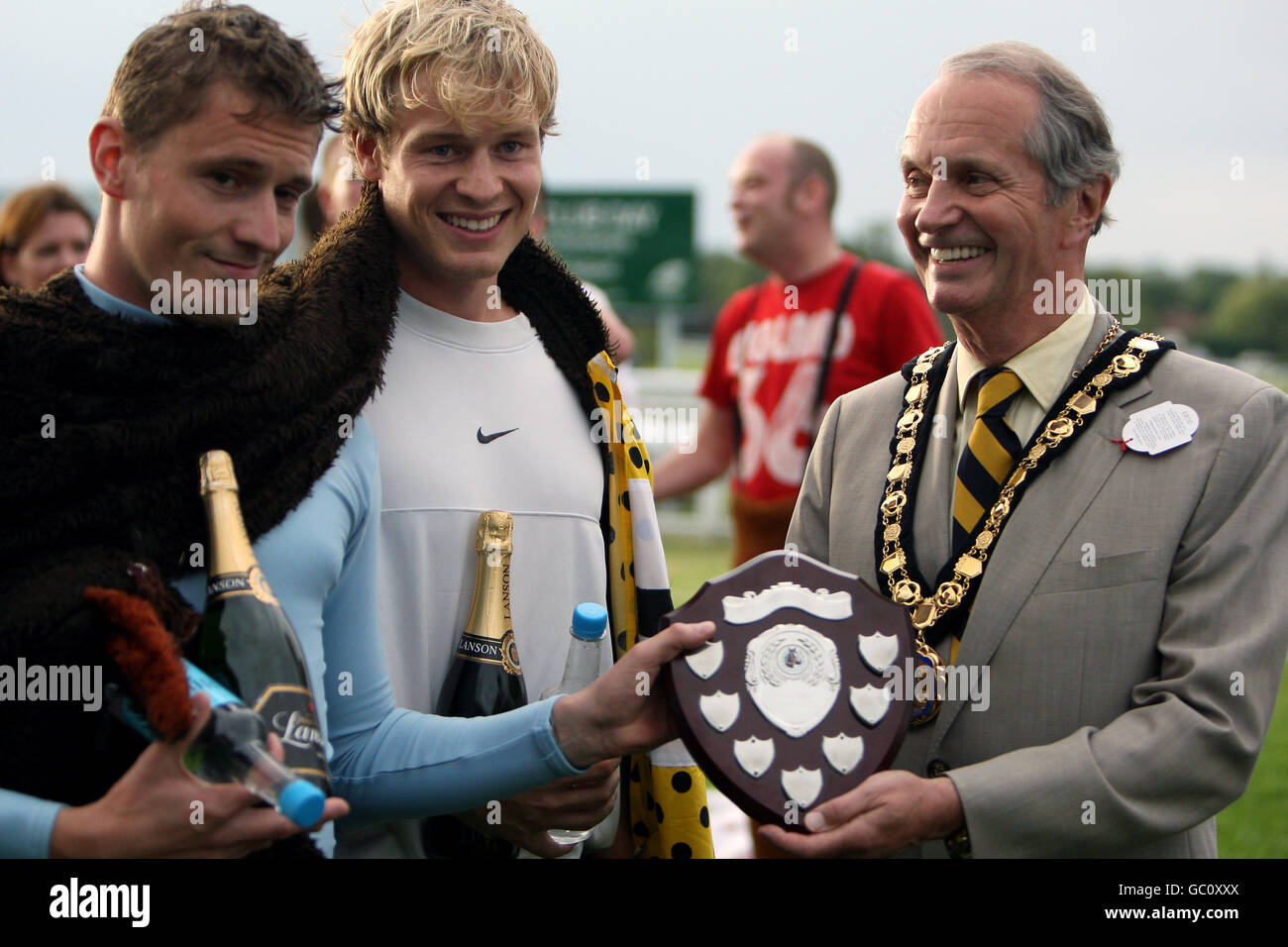 Neigh Chance receive their trophy after winning the Mayor's pantomime horse race Stock Photo