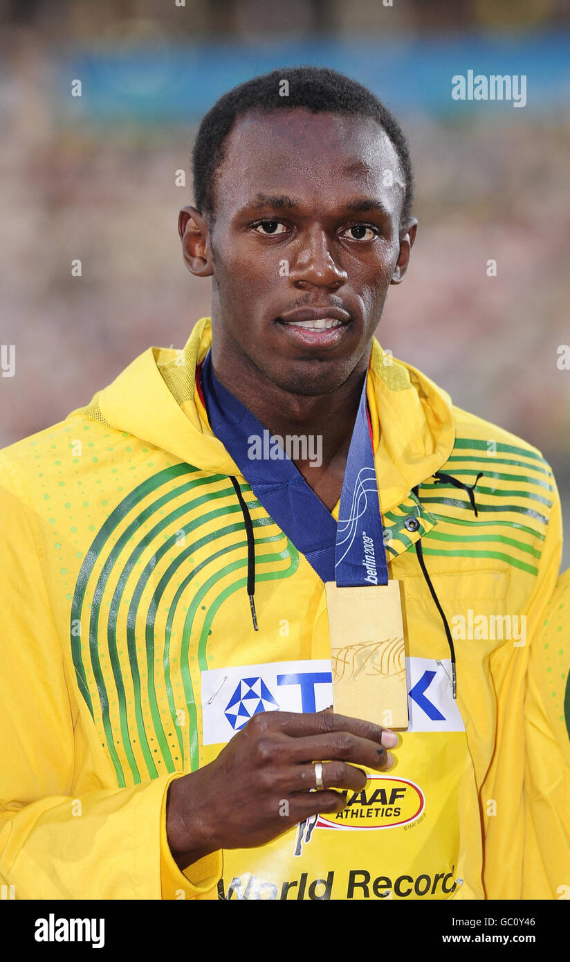 Jamaica's Usain Bolt with the Gold Medal he won in the 100m Final
