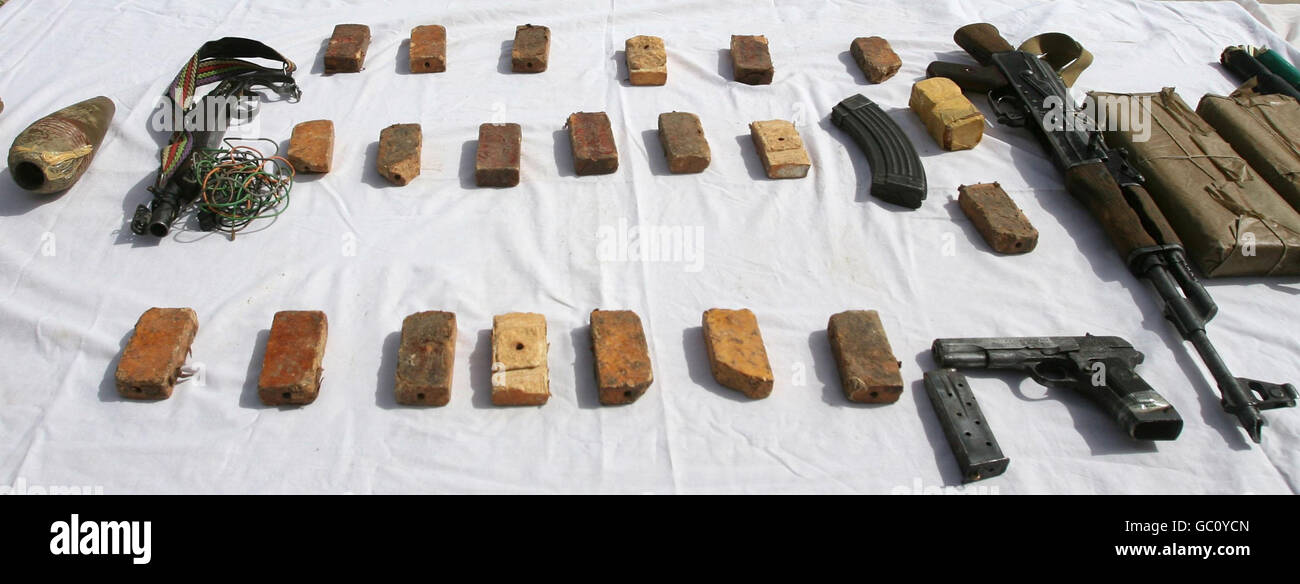Blocks of TNT explosive that can be used in IEDs and other weapons seized from suspected insurgents are shown to the media at Helmand Police HQ in Lashkar Gar, Afghanistan. Stock Photo