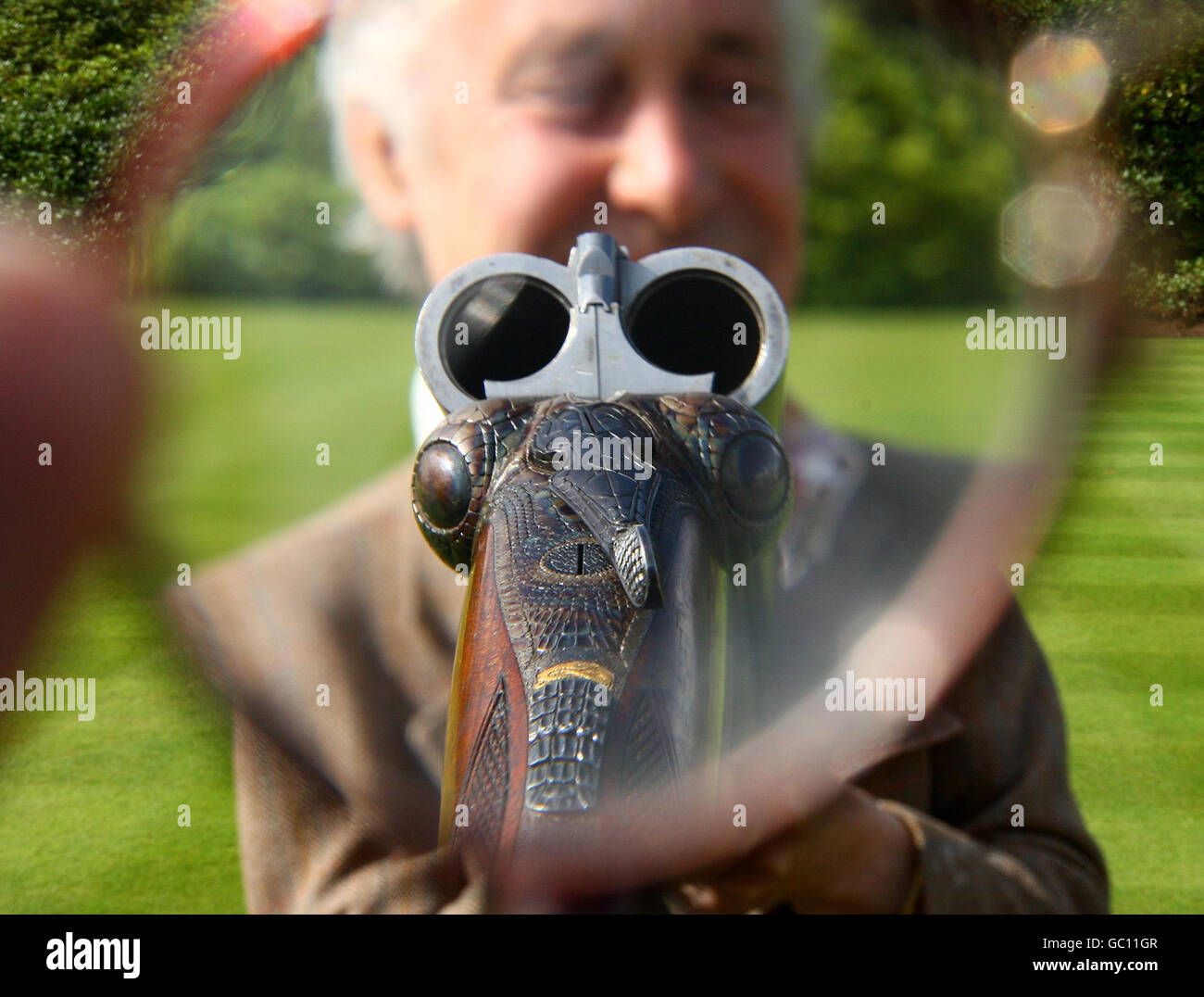 Gun Engraver Malcolm Appleby holds an unusual 12-bore 'Crocodile' gun by David McKay Brown. Malcolm engraved the gun to look like a crocodile and it is expected to be sold for between 25,000-35000 at an auction of Fine, Modern and Vintage Sporting Guns at Gleneagles Hotel on Monday August 24. Stock Photo