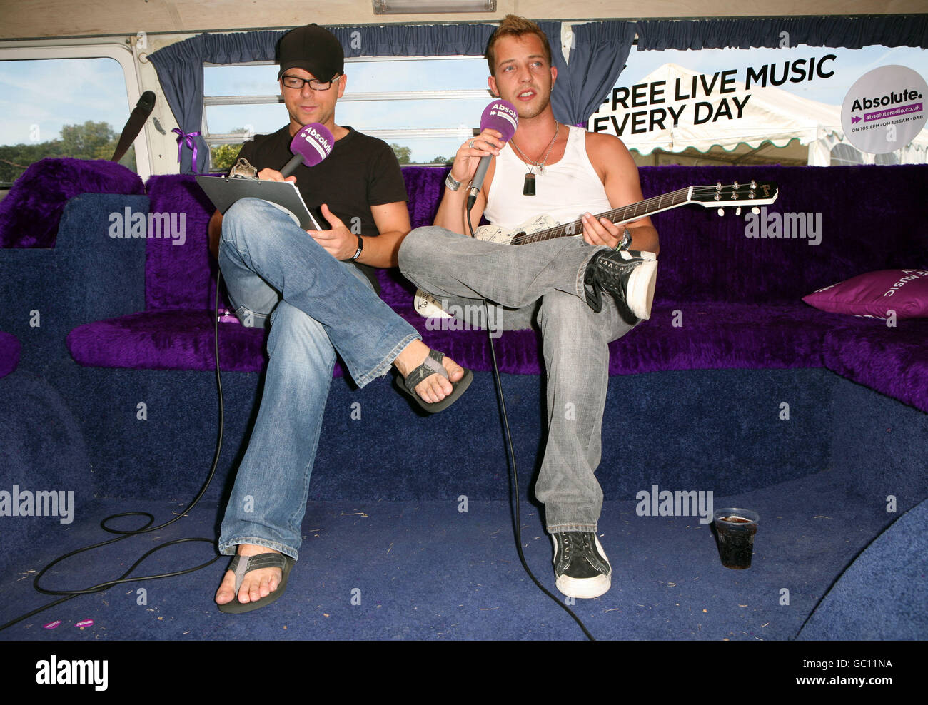 James Morrison (right) is interviewed by Absolute Radio DJ Ben Jones backstage at V Festival in Hylands Park, Chelmsford. Stock Photo