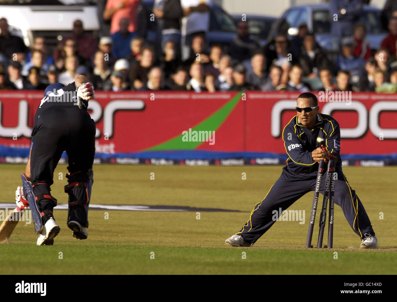 Sussex's Michael Yardy (left) is run out by Durham's Gareth Breese during the match at the County Ground, Hove. Stock Photo