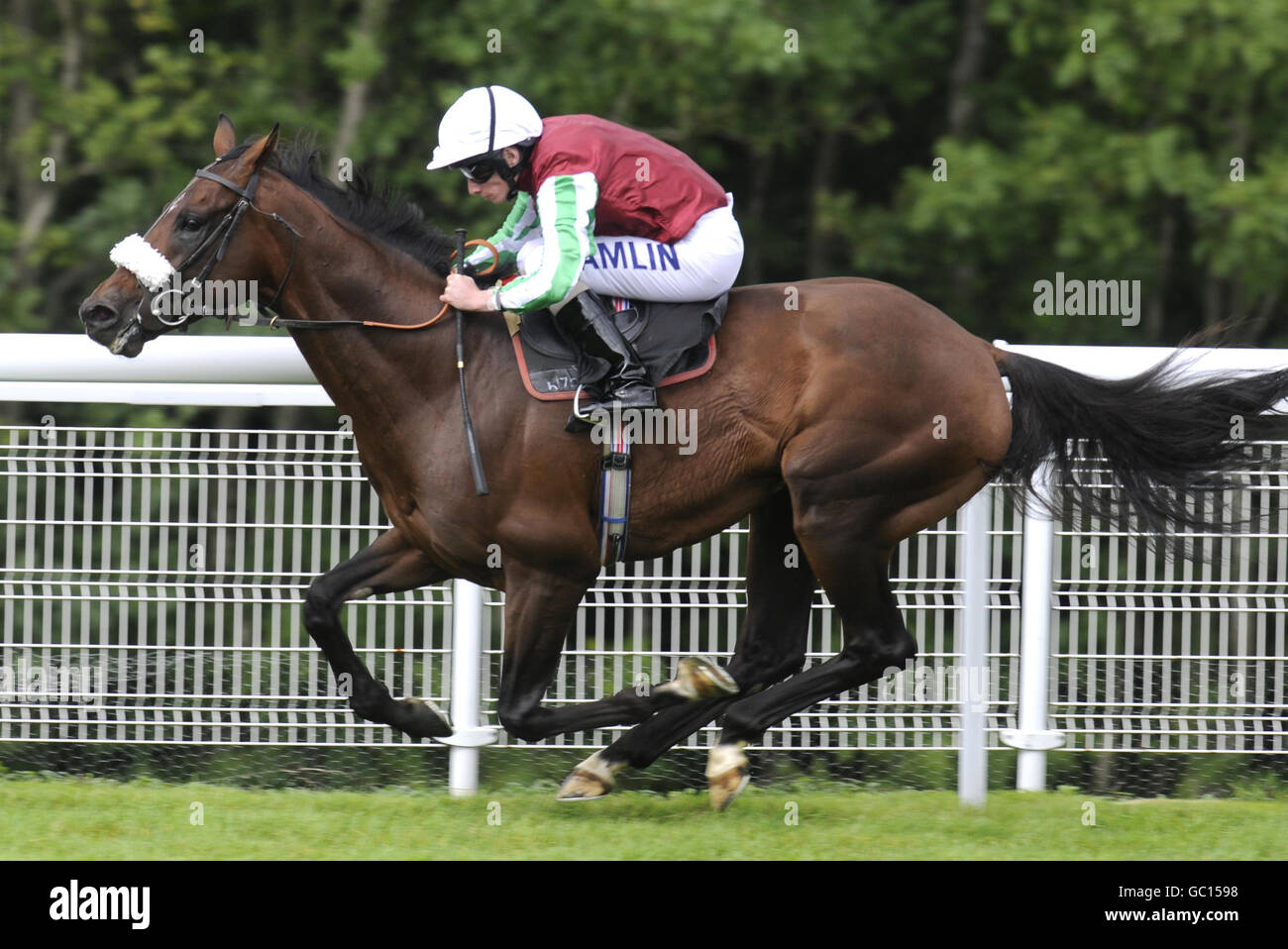 Mourilyan and Ryan Moore win The Windflower March Stakes at Goodwood Racecourse, West Sussex. Stock Photo