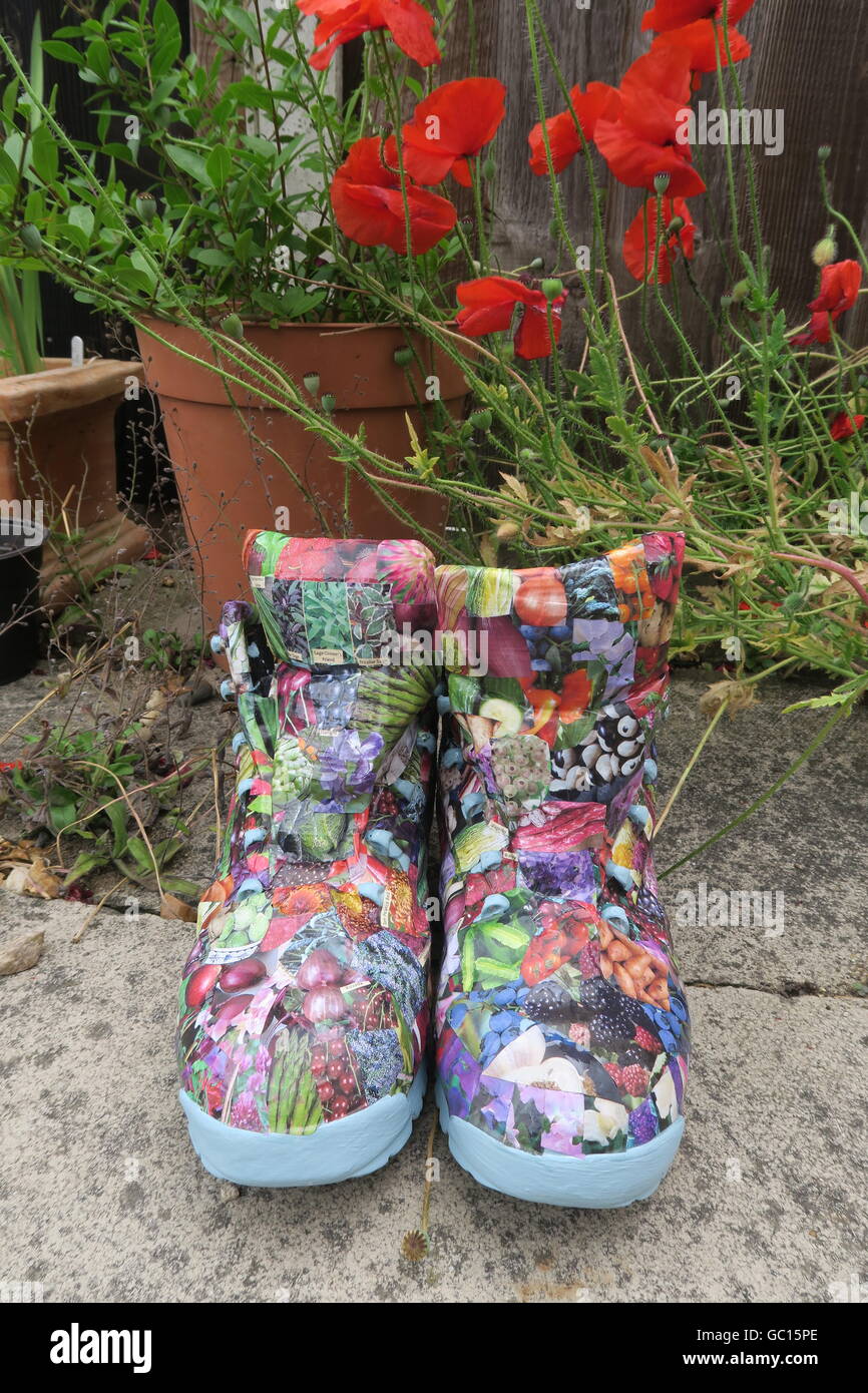 Walking Boots Re Purposed As Garden Containers And Decorated With