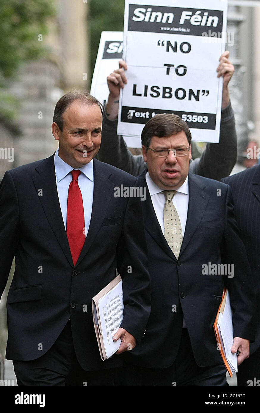 Sinn Fein supporters advocating a No Vote, as Taoiseach Brian Cowen (right) and Minister for Foreign Affairs Michael Martin of Fianna Fail arrive to launch their Lisbon campaign at The Royal College of Physicians on Kildare Street in Dublin. Stock Photo