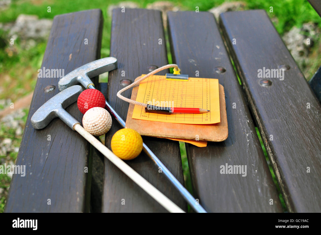 Mini golf equipment on the bench Stock Photo