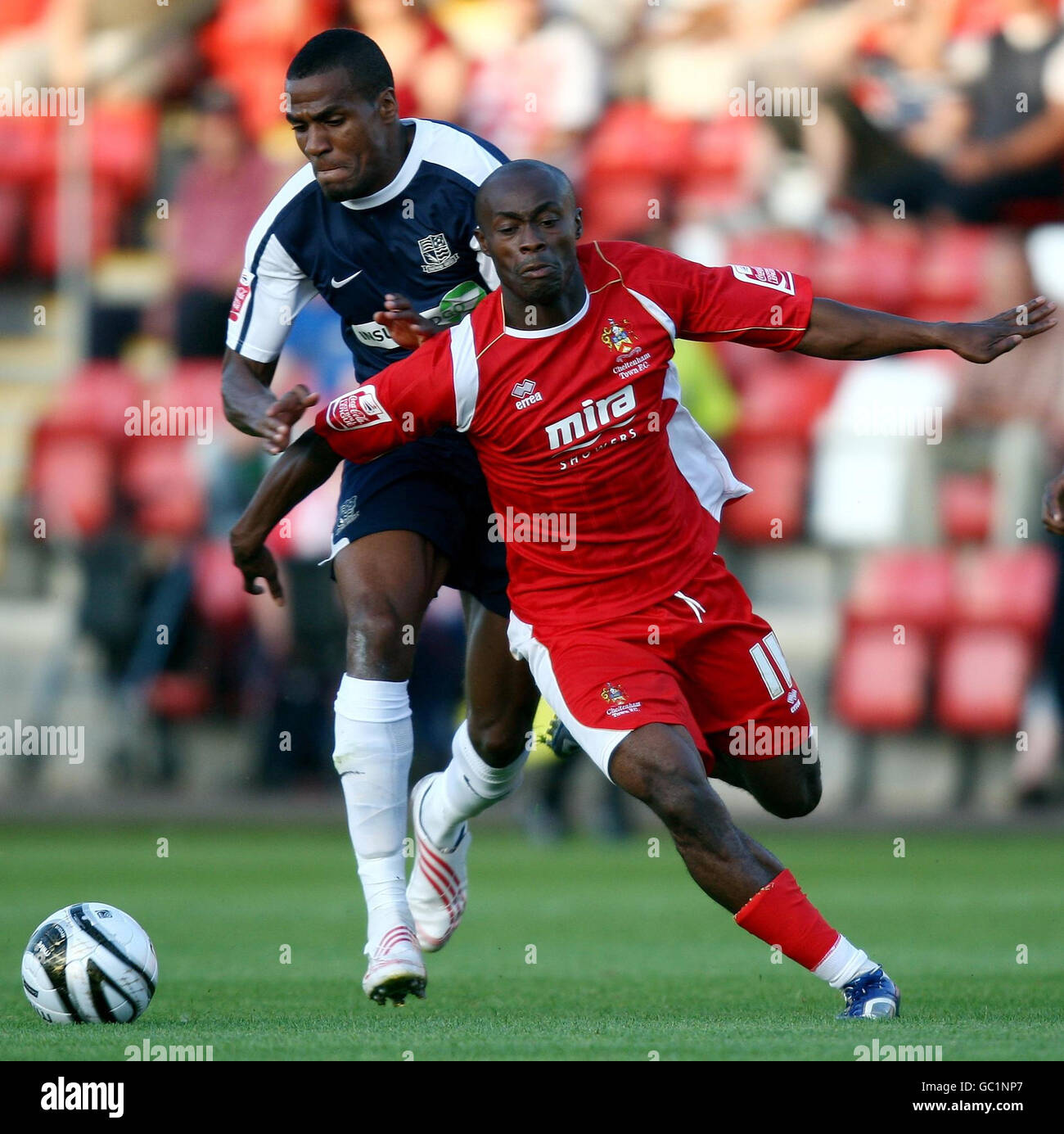 Cheltenham Town's Elvis Hammond (right) gets away from Southend United's Jean-Francois Christophe during the Carling Cup First Round match Whaddon Road, Cheltenham. Stock Photo