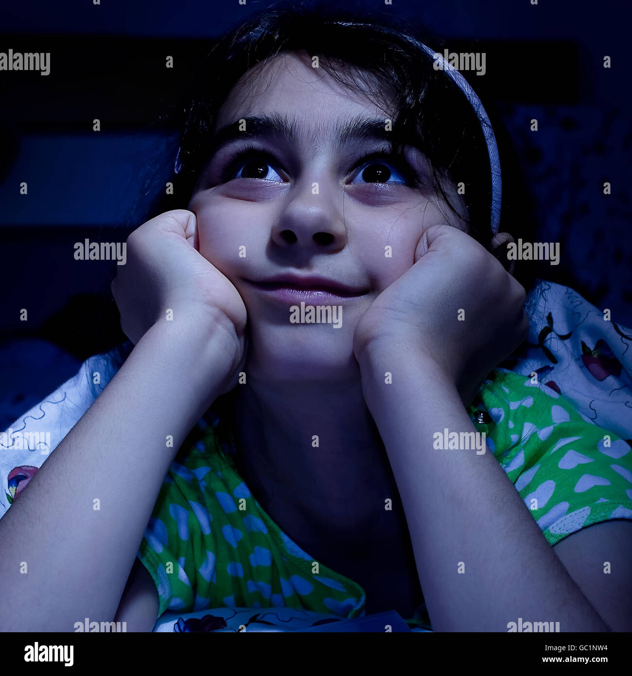 little girl laying in bed daydreaming, before sleep Stock Photo Alamy