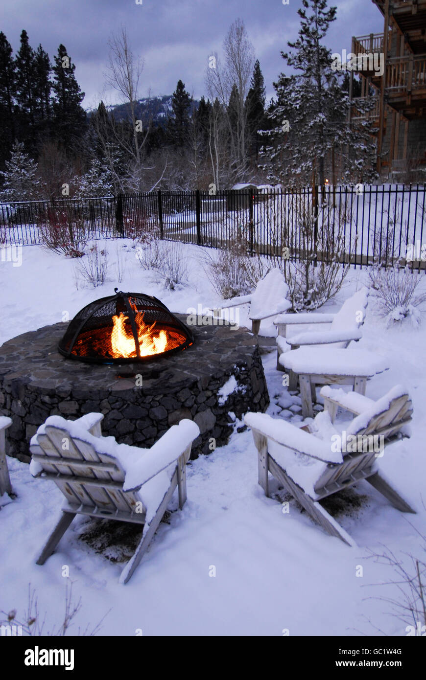 Fire Pit And Adirondack Chairs In Snow In Lake Tahoe California