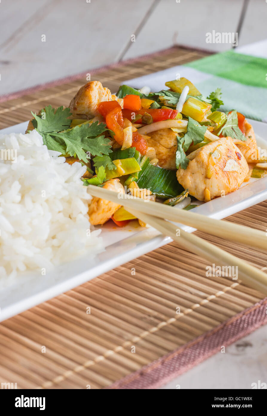 Asian dish with chicken, vegetables, cilantro and leek Stock Photo