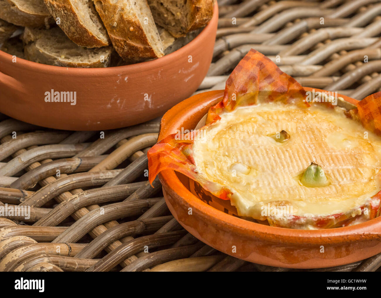 French camembert baked with garlic, served with bread Stock Photo