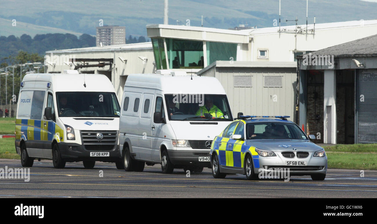 A convoy carrying Lockerbie bomber Abdelbaset Ali Mohmed Al Megrahi arrives at Glasgow Airport for a plane bound for Tripoli, after he was released on compassionate grounds by Scottish Justice Secretary Kenny MacAskill. Stock Photo