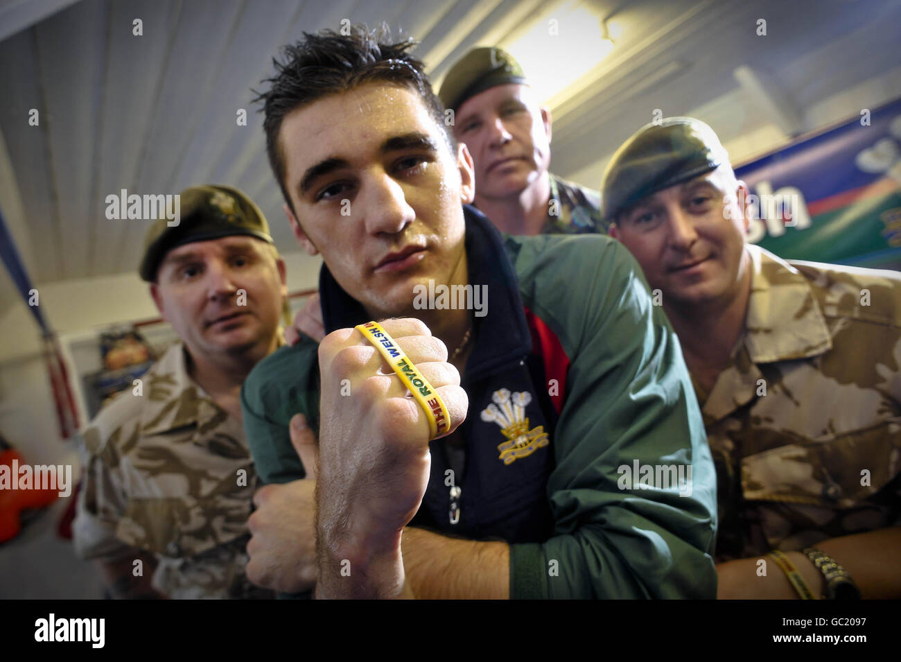 British and Commonwealth Light-Heavyweight Champion Nathan Cleverly, who defends his commonwealth title at Belfast's Odyssey Arena on October 9, is pictured with soldiers from the Royal Welsh regiment, (left to right) Captain Rob Rees, Warrant Officer class 2 Mal Kellheer-Griffiths and Warrant Officer class 2 Dave Matthews, as Nathan shows his support for the The Royal Welsh and the great job they are doing by fully endorsing 'The Soldiers Charity' and wearing the 'Support the Royal Welsh in Afghanistan' wrist band. Stock Photo