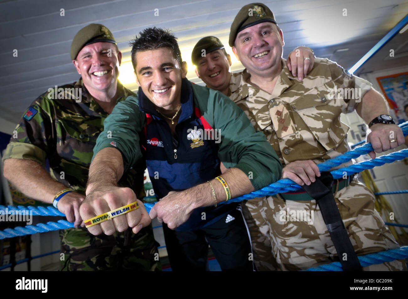 British and Commonwealth Light-Heavyweight Champion Nathan Cleverly, who defends his commonwealth title at Belfast's Odyssey Arena on October 9, is pictured with soldiers from the Royal Welsh regiment, (left to right) Warrant Officer class 2 Mal Kellheer-Griffiths, Warrant Officer class 2 Dave Matthews and Captain Rob Rees,, as Nathan shows his support for the The Royal Welsh and the great job they are doing by fully endorsing 'The Soldiers Charity' and wearing the 'Support the Royal Welsh in Afghanistan' wrist band. Stock Photo