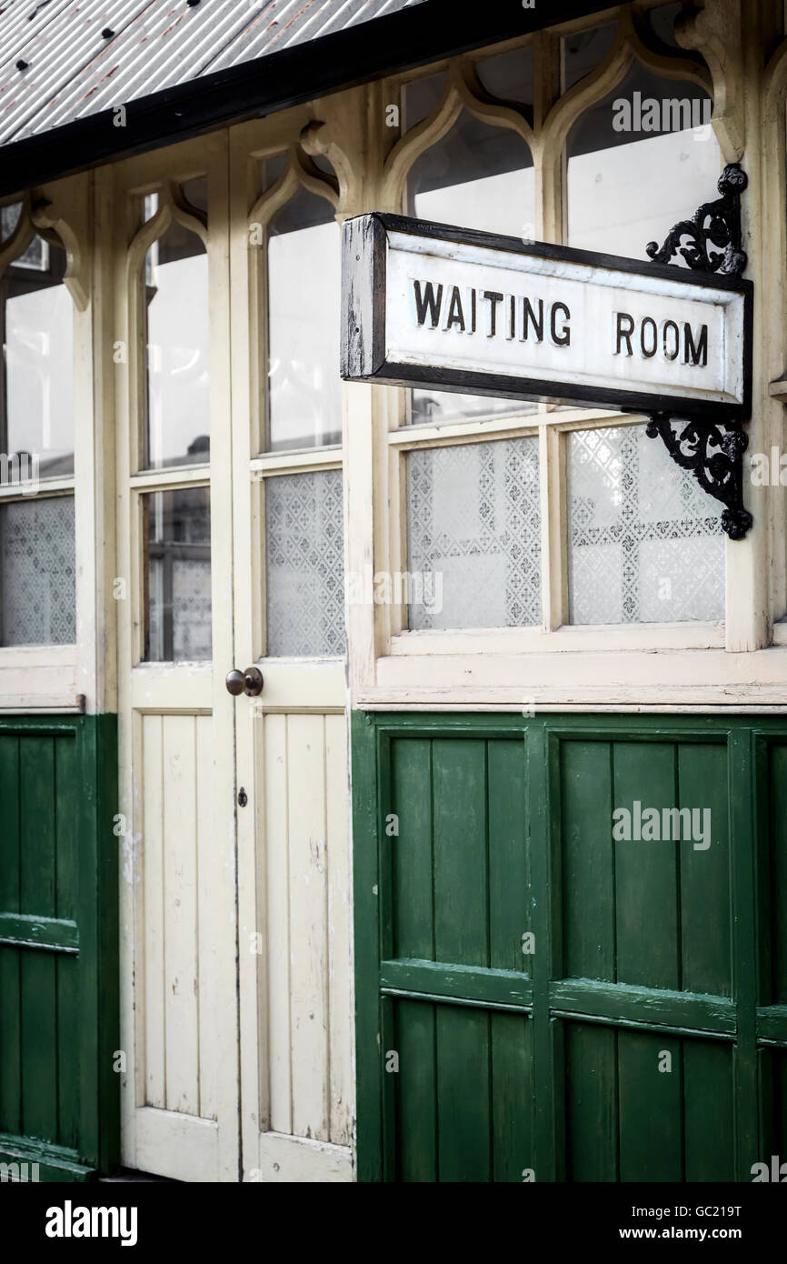 a waiting room in an old train station Stock Photo