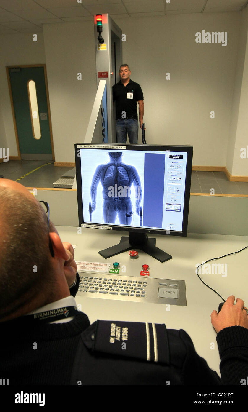 PICTURE POSED BY MODEL A man is X-rayed at Birmingham International airport. Stock Photo
