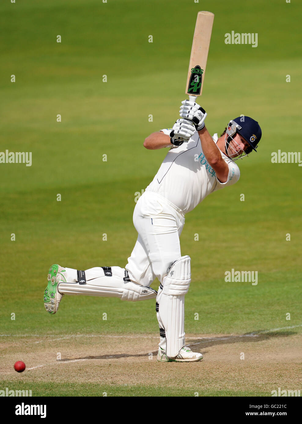 Full length batting bats hits out ampics hires stock photography and