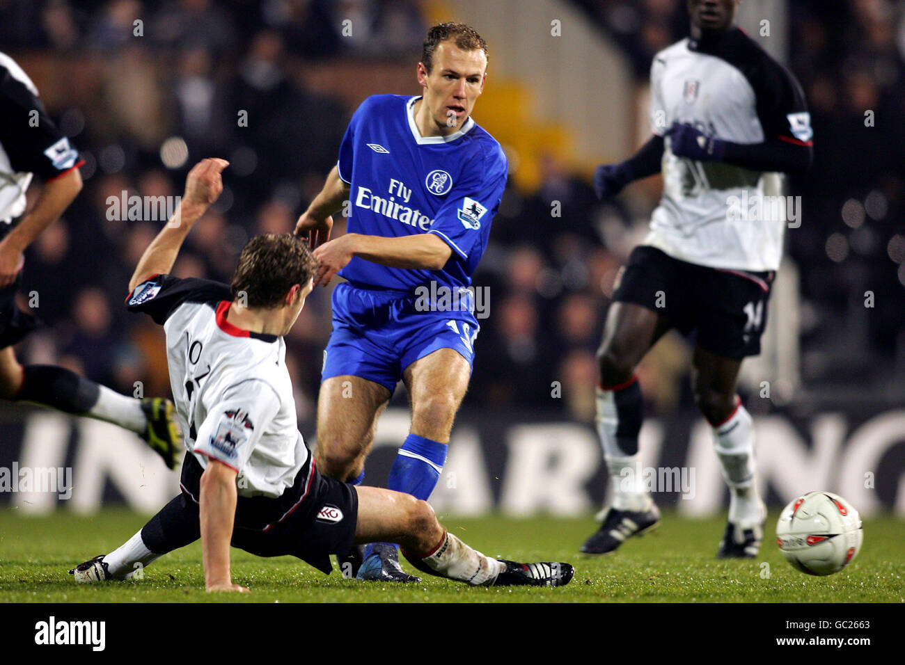 Soccer - Carling Cup - Quarter Final - Fulham v Chelsea. Fulham's Moritz Volz tackles Chelsea's Arjen Robben Stock Photo