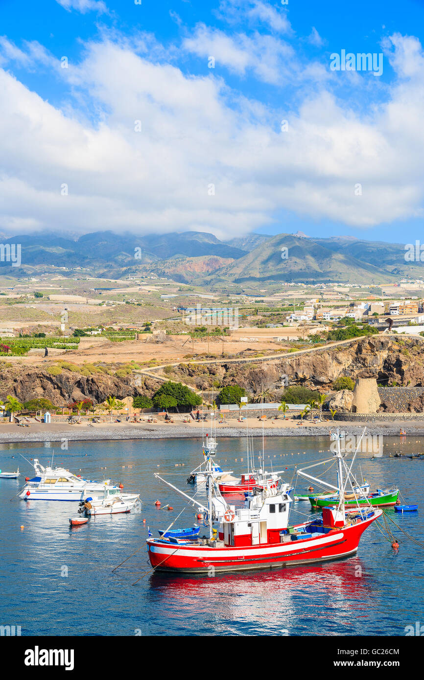 Traditional fishing boats in San Juan port with mountains in background, Tenerife, Canary Islands, Spain Stock Photo