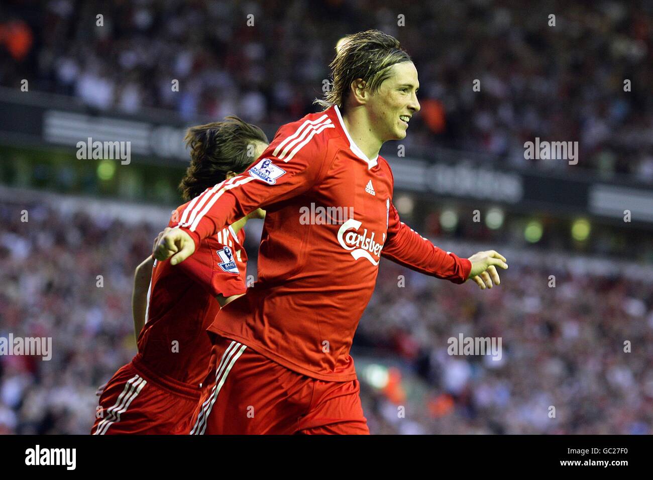 Soccer - Barclays Premier League - Liverpool v Stoke City - Anfield. Liverpool's Fernando Torres (right) celebrates with teammate Yossi Benayoun (left) after scoring his sides first goal of the game Stock Photo