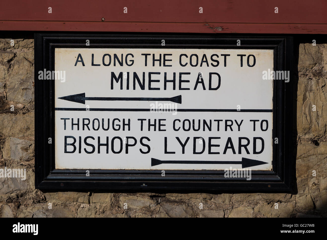 A vintage sign on the Minehead steam train railway indicating the route from Minehead coast to Bishops Lydeard Stock Photo