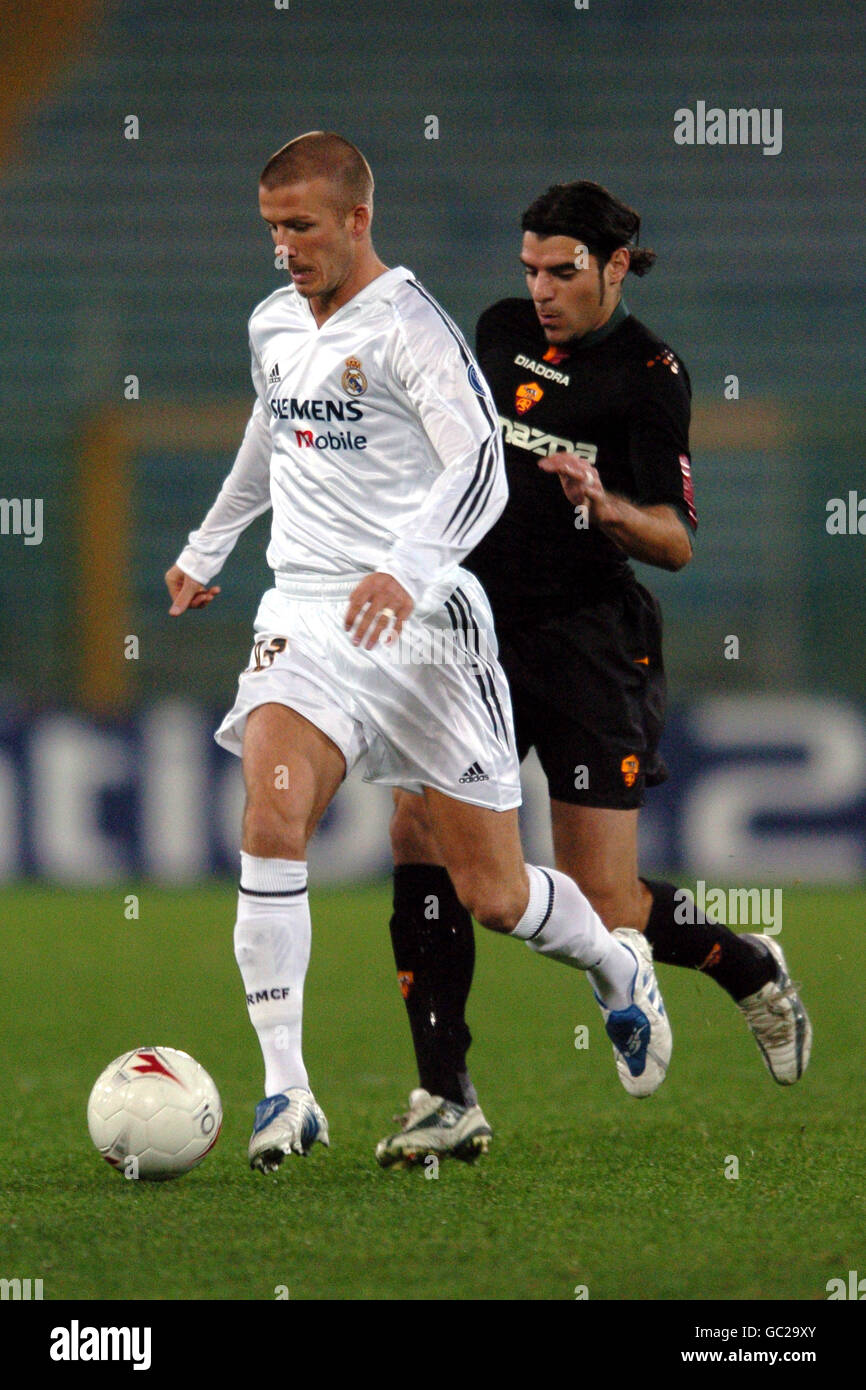 Real madrids david beckham is tracked by romas simone perrotta hires