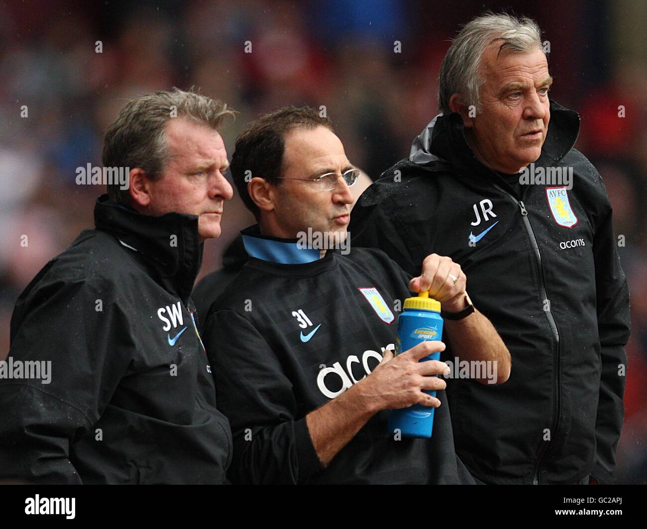 Aston Villa manager Martin O'Neill (centre) with his firrst team coach  Steve Walford and assistant manager John Robertson (right) on the touchline  Stock Photo - Alamy