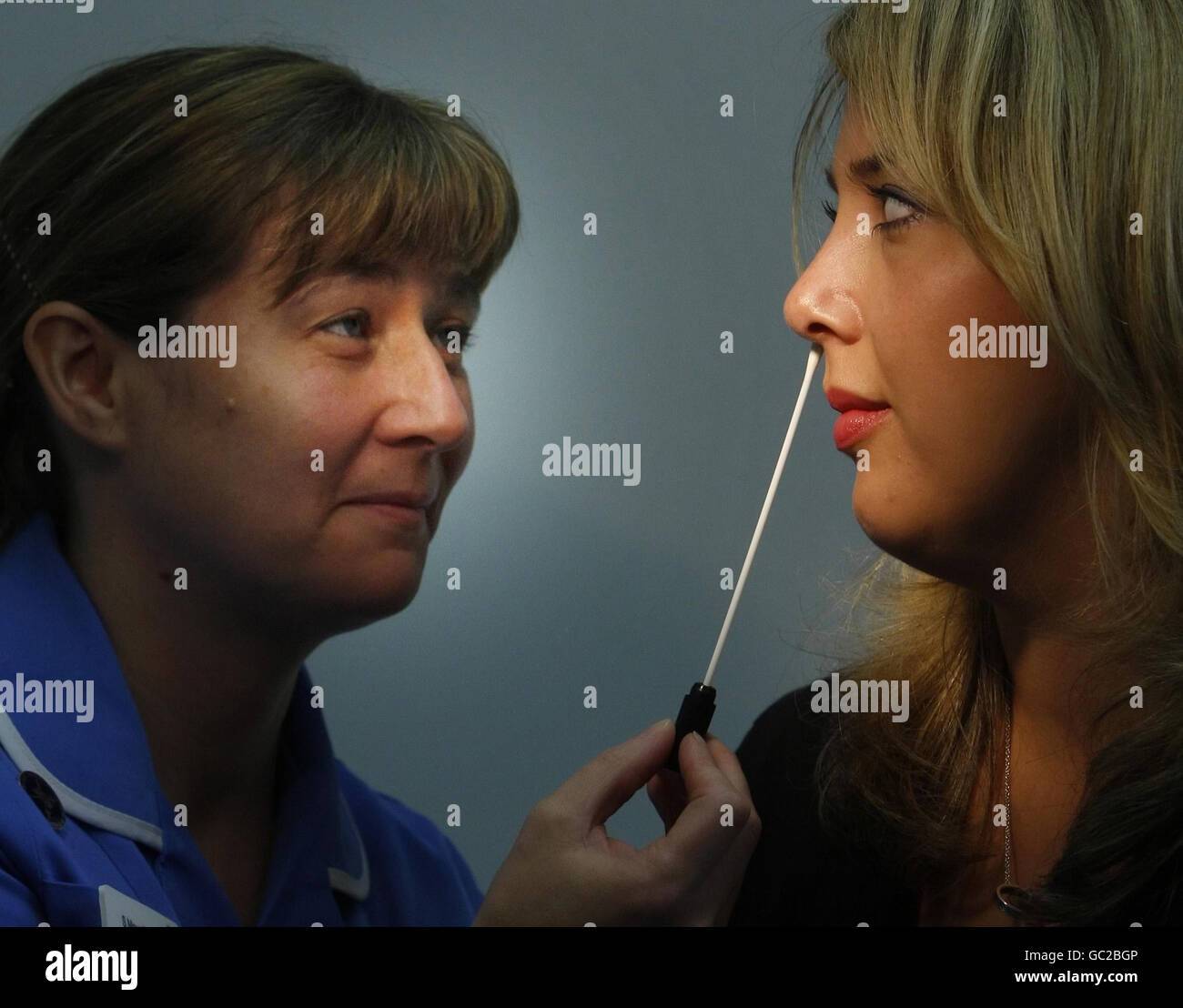PICTURE POSED BY MODEL. Staff Nurse Samantha Mountford takes a nasal swab from Emma Gregory at the Royal Alexandra Hospital in Paisley, to demonstrate a new MRSA screening program. Stock Photo