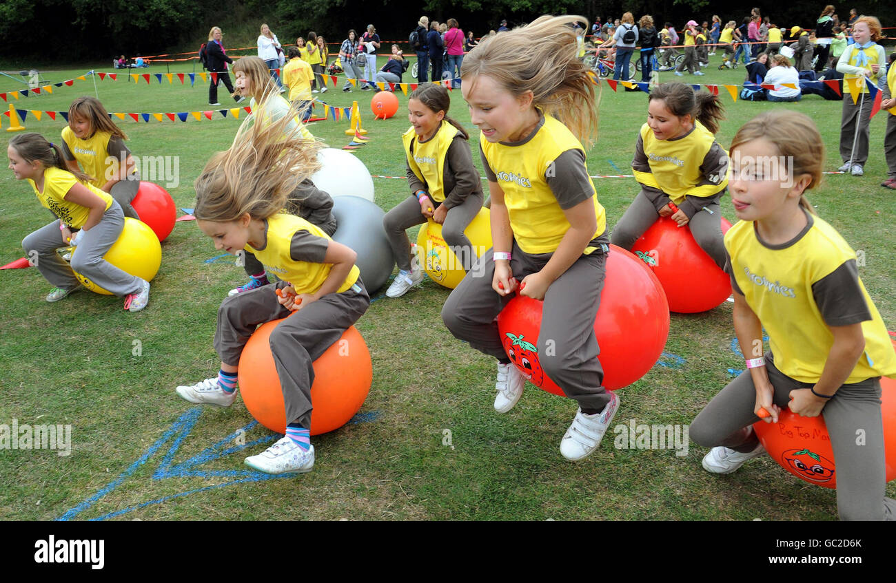 Brownies during the space hopper race at the Girl Guiding UK's Centenary celebration gathering at Crystal Palace, London. Stock Photo