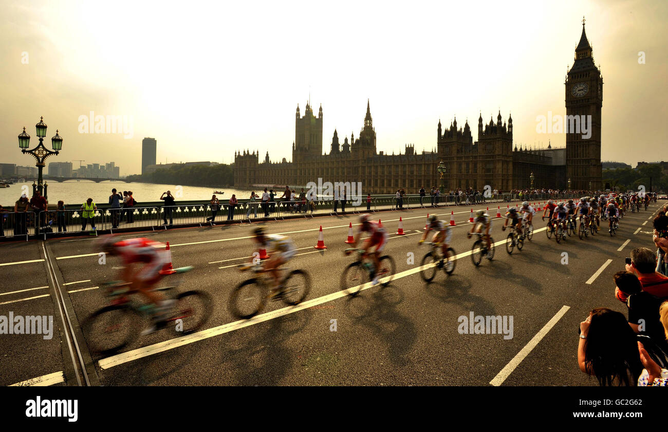 Cyclist's ride over Westminster Bridge in front of the Houses of Parliament with the bunch in the final Tour of Britain stage in London, in support of the Prostate Cancer Charity. Stock Photo