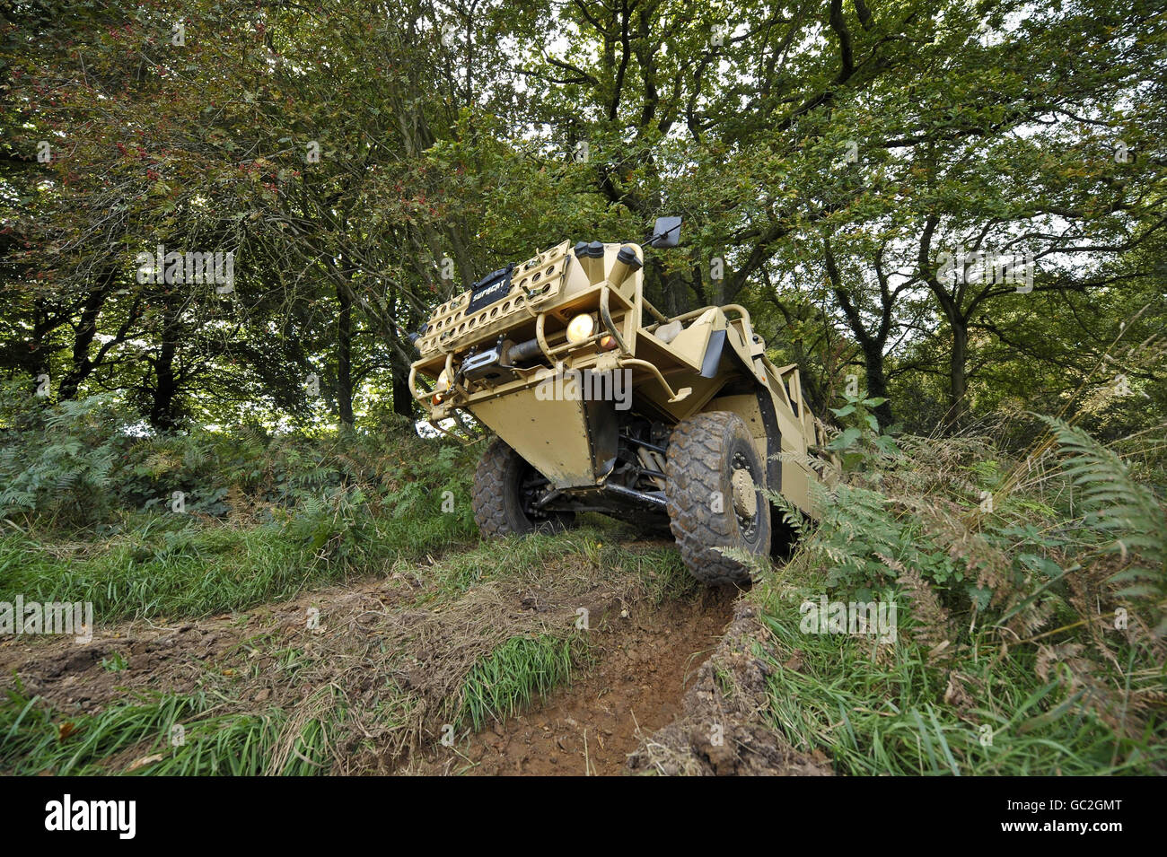 A Supacat high mobility vehicle named the 'Jackal' by the British military forces is pictured during a test run for the media in a wooded area near Dunkerswell, Honiton, Devon, where the vehicles are manufactured. Stock Photo