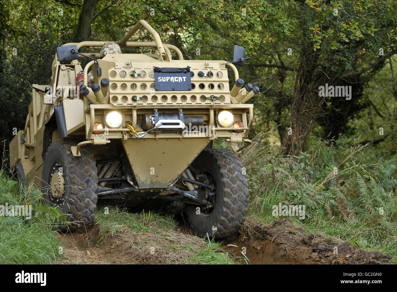 A Supacat high mobility vehicle named the 'Jackal' by the British military forces is pictured during a test run for the media in a wooded area near Dunkerswell, Honiton, Devon, where the vehicles are manufactured. Stock Photo