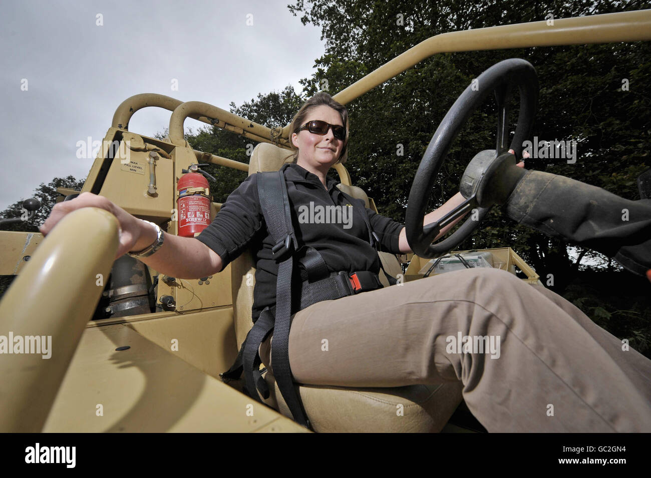 Chief test driver and Trials and Development Manager Lizzie Jones drives a Supacat high mobility vehicle named the 'Jackal' by the British military forces during a test run in a wooded area near Dunkerswell, Honiton, Devon. Stock Photo