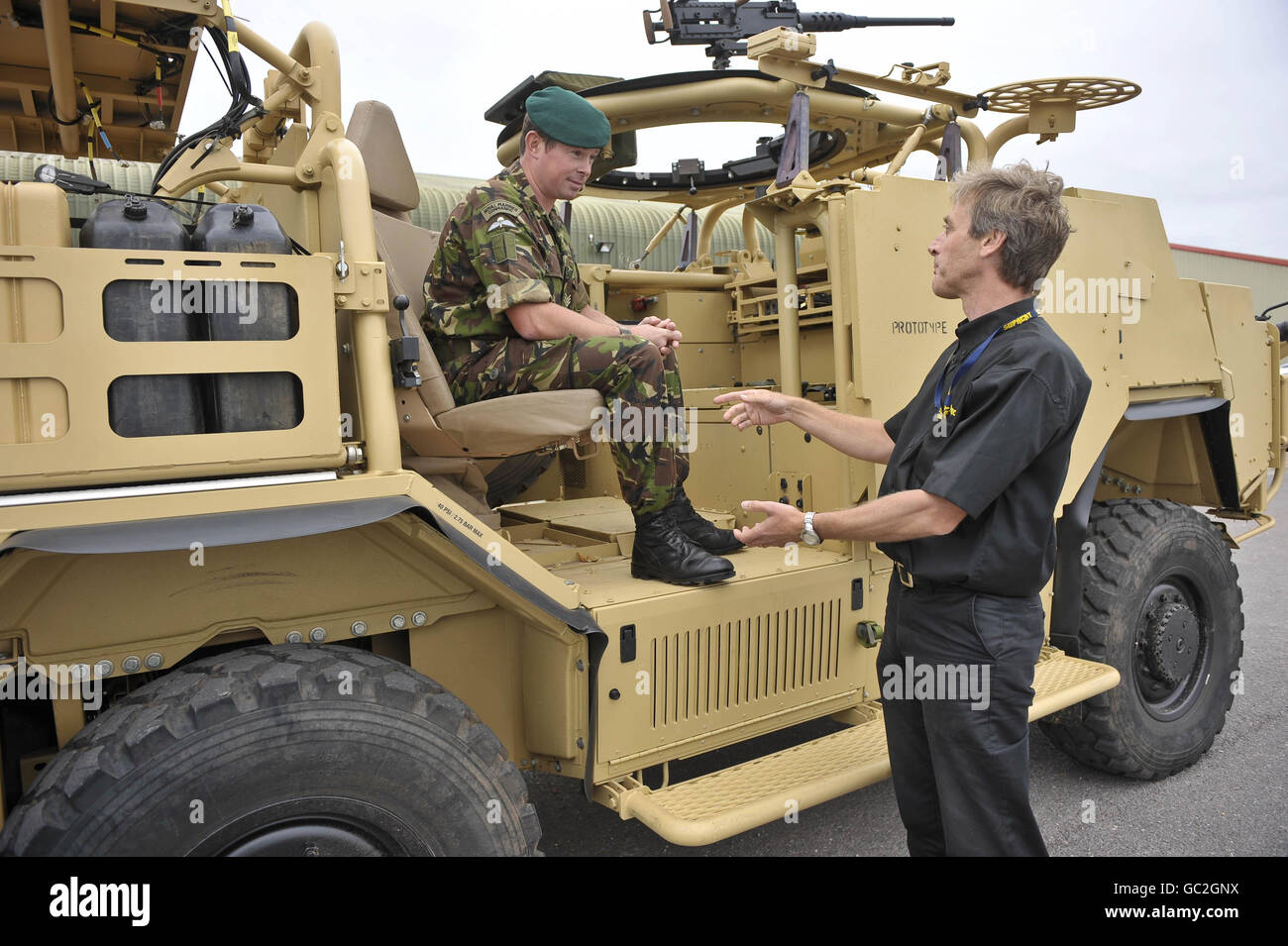 Sergeant Adrian Foster, 42 Commando and Chief Engineer Sean Limbrick at the Supacat factory near Dunkerswell, Honiton, Devon, where the 'Jackal' vehicles are manufactured, talk about the benefits of the new 'Jackal 2' high mobility vehicle that will be deployed to Afghanistan as an upgrade to the ones already in theatre. Stock Photo