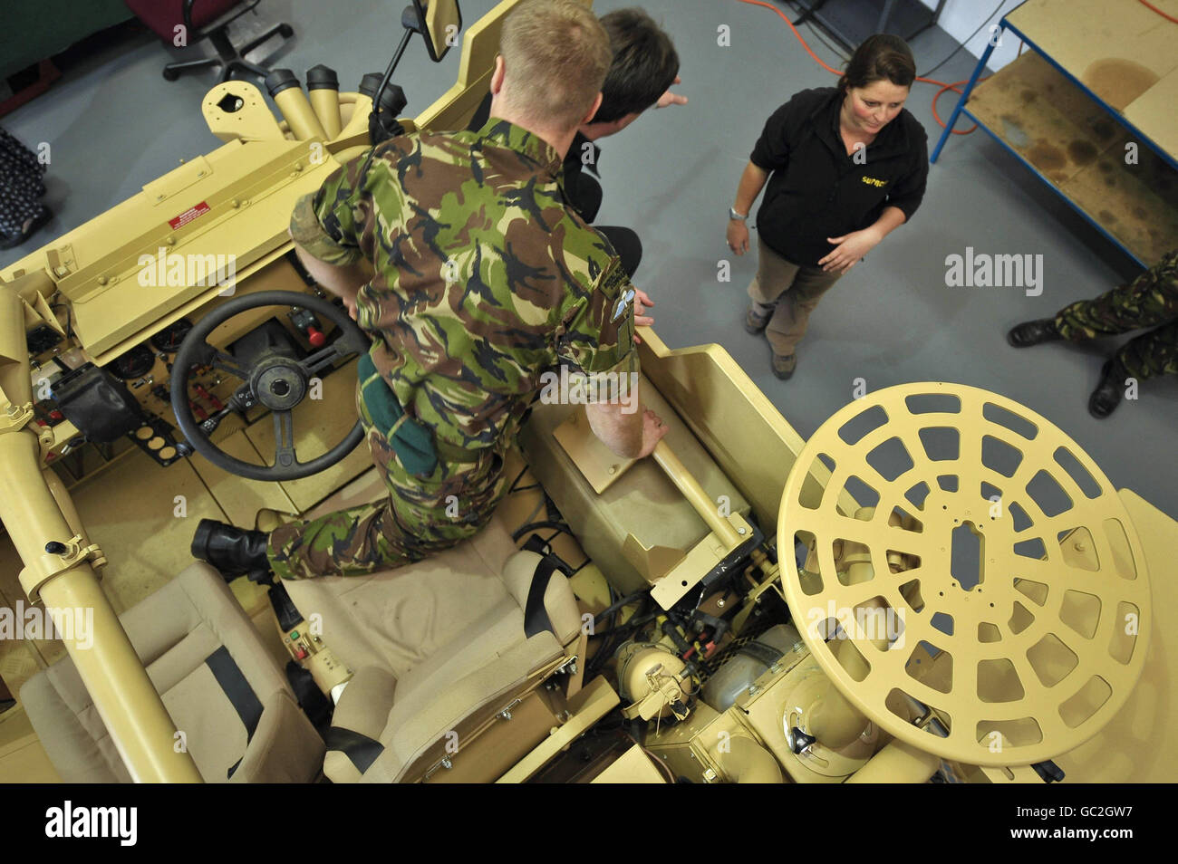 Commandos and technical staff at the Supacat factory near Dunkerswell, Honiton, Devon, where the vehicles are manufactured, talk about upgrades for the new 'Jackal 2' high mobility vehicle that will be deployed to Afghanistan as an upgrade to the ones already in use. Stock Photo