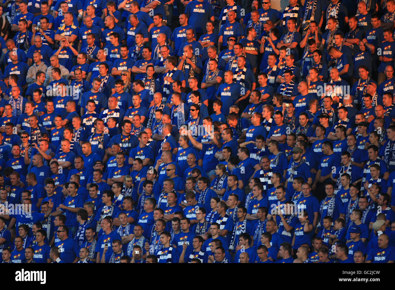 The KKS Lech Poznan Kolejorz fans cheer on their side in the stands Stock Photo