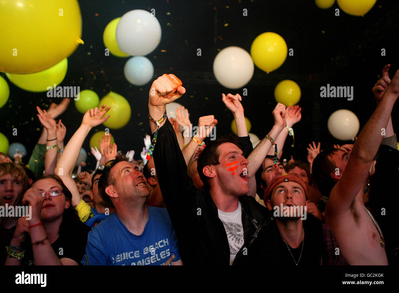 Fans watch the Flaming Lips performing on stage during the Electric