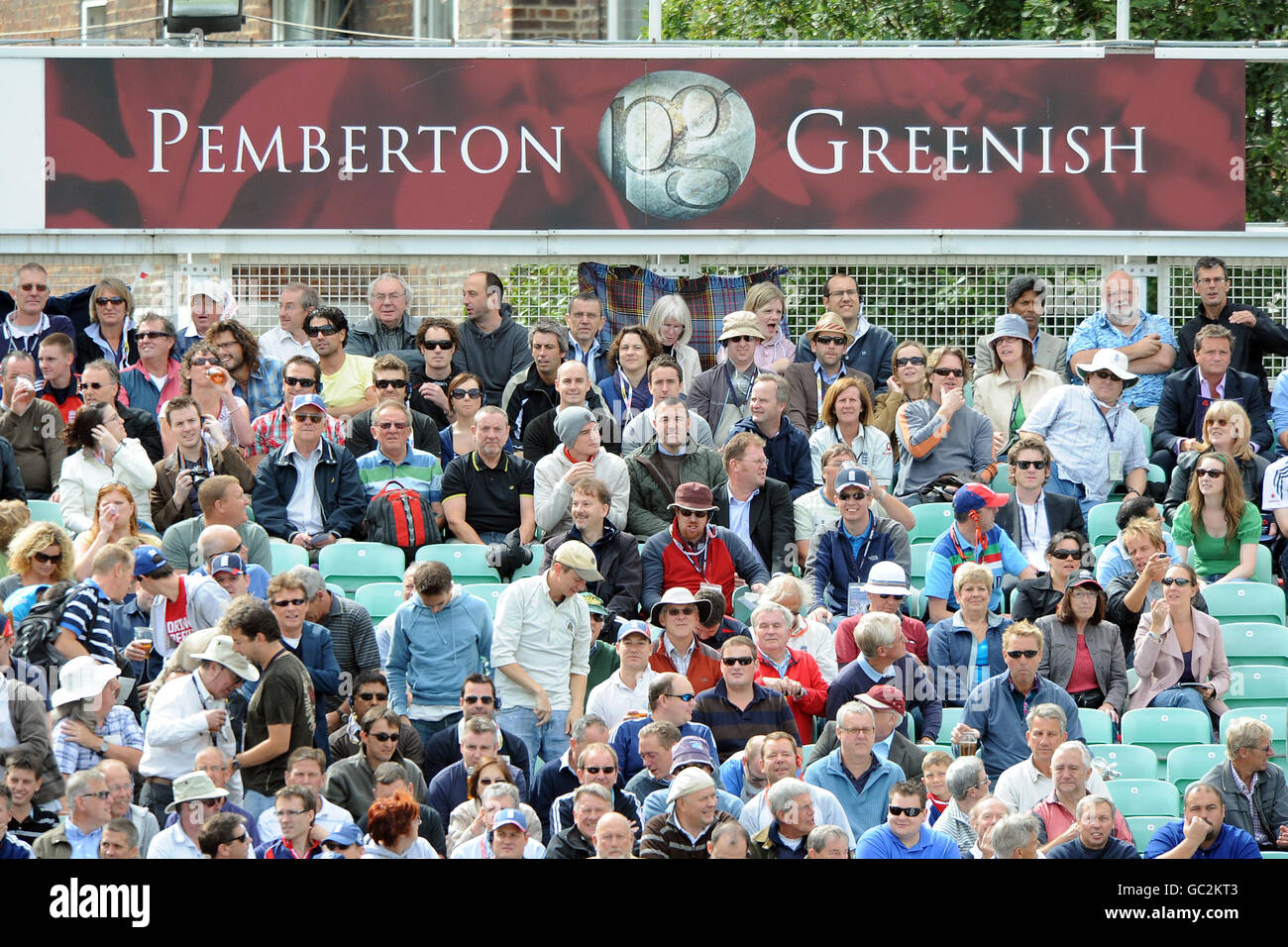 Pemberton Greenish signage at the Brit Oval as fans watch the action