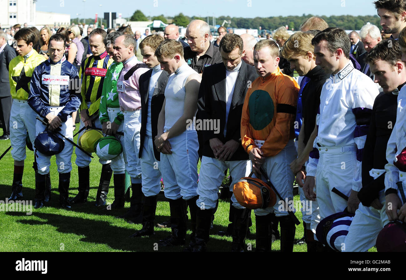 Jockeys hold a moments silence ahead of The Frenchgate 5 Raceday in the Ladbrokes St Leger Festival at Doncaster Racecourse. Stock Photo