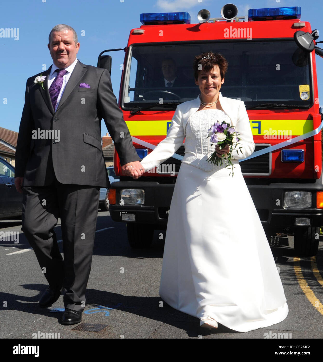 Fire fighter couple wed on 9.9.(0)9 Stock Photo