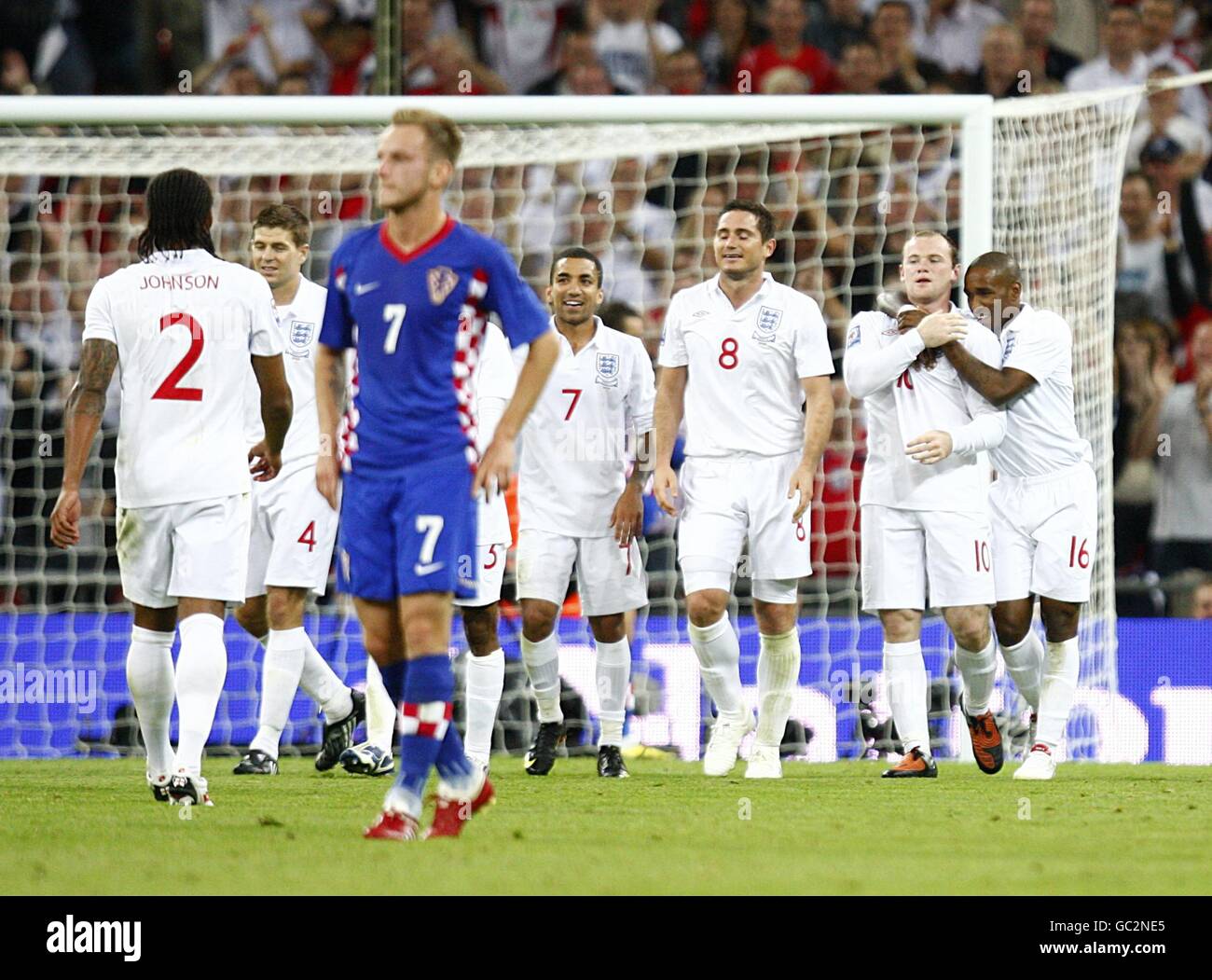 Soccer - FIFA World Cup 2010 - Qualifying Round - Group Six - England v Croatia - Wembley Stadium. England's Wayne Rooney (2nd right) is congratulated by his team mates after scoring thier sides fifth goal of the game Stock Photo