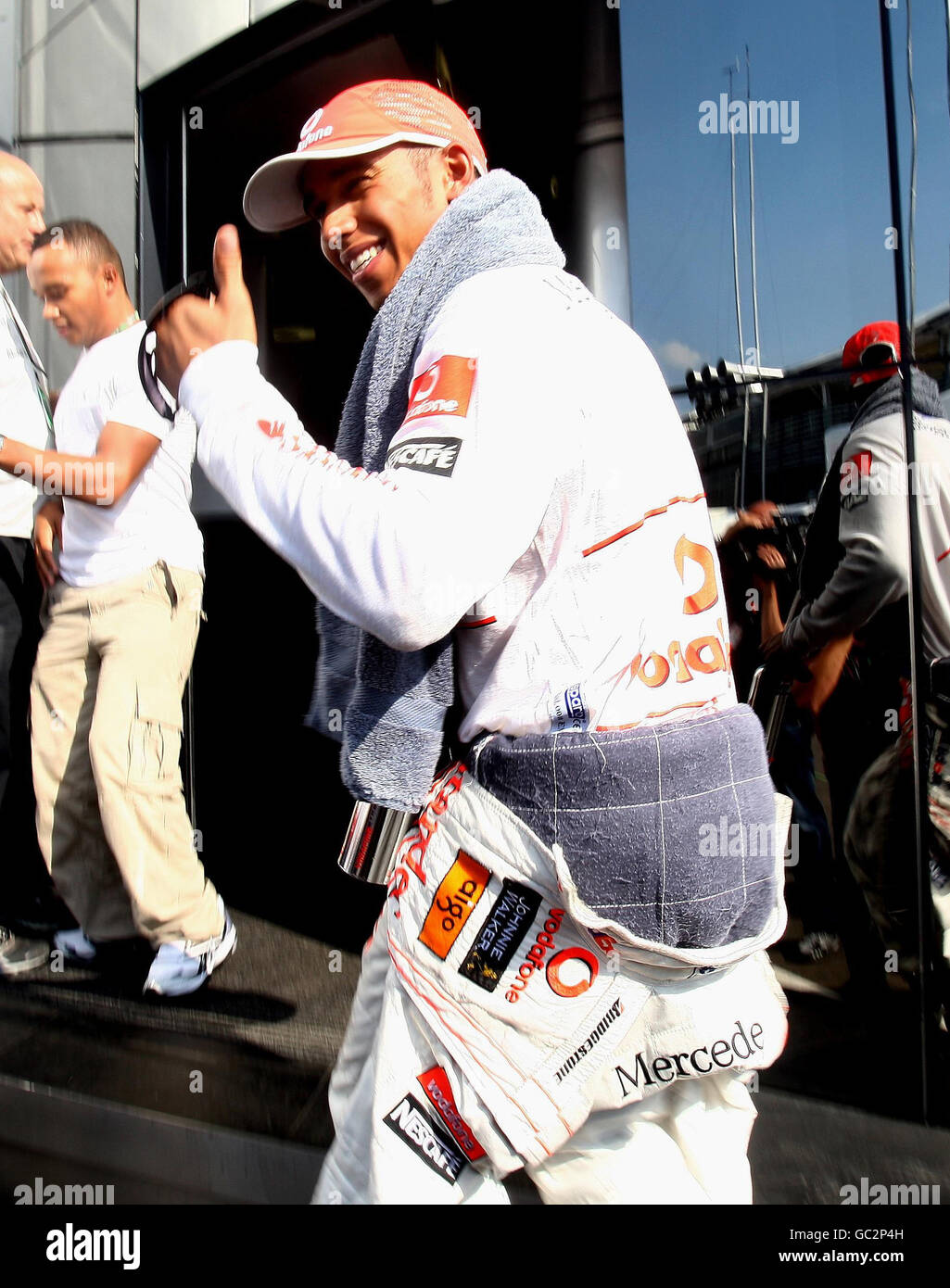 Vodafone McLaren driver Lewis Hamilton makes his way back to the McLaren motorhome after his last lap crash during the Italian Grand prix at the Monza Circuit, Italy. Stock Photo