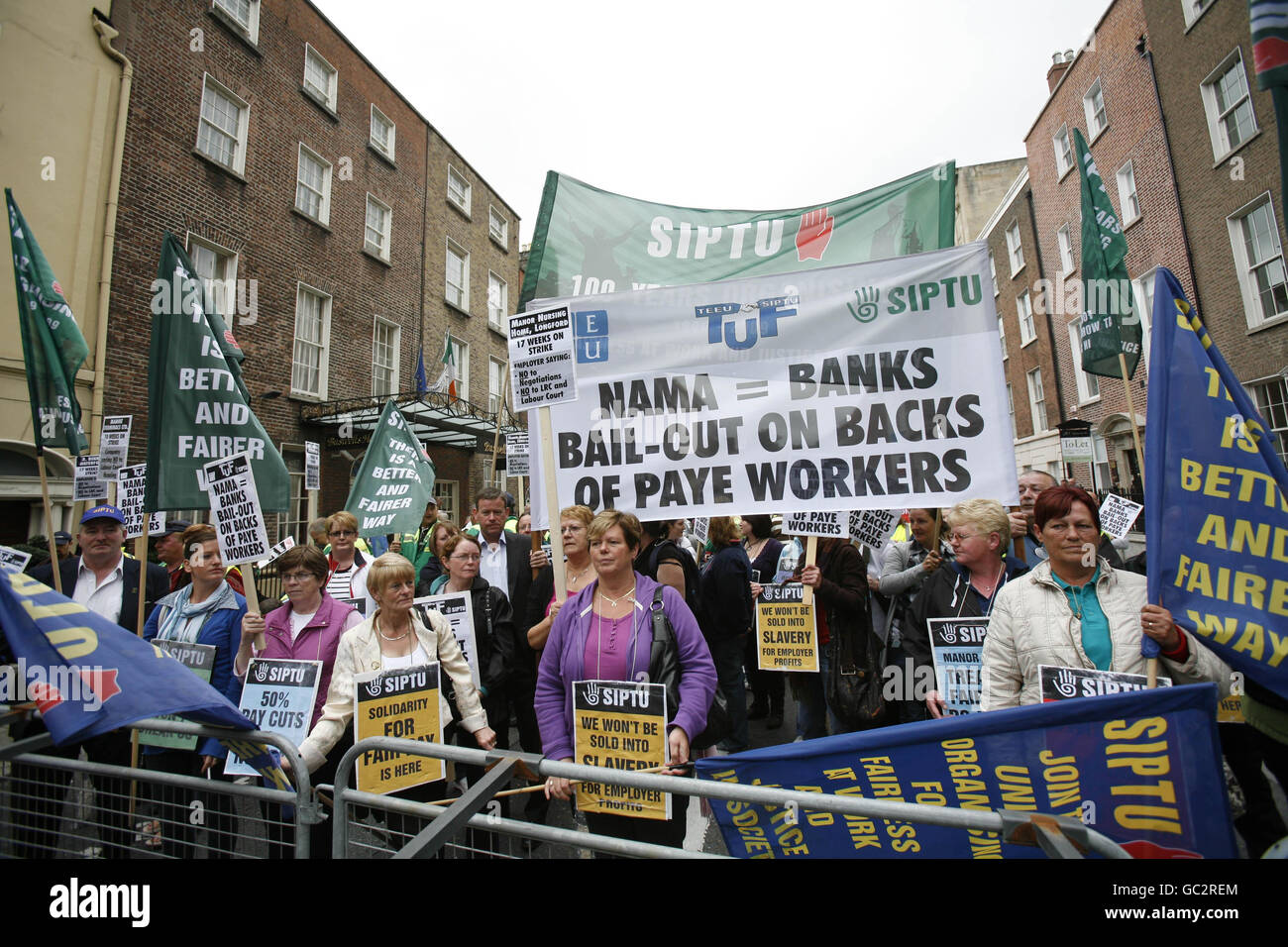 Protesters gather outside leinster house in dublin hires stock
