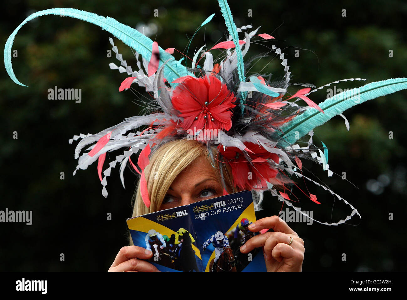 Alison Scott from Symington wearing a hat designed by Rachel Wilkes during the Gold Cup Festival at Ayr Racecourse, Ayr. Stock Photo